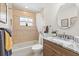 Well-lit bathroom with a granite vanity, tiled shower, and coordinated accessories, offering a clean aesthetic at 5000 Galleon Ct, New Port Richey, FL 34652