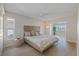 Bright bedroom featuring a headboard, pillows, and windows with natural light at 5000 Galleon Ct, New Port Richey, FL 34652