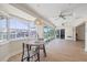 Bright dining area with bay windows and views of the backyard pool at 5000 Galleon Ct, New Port Richey, FL 34652