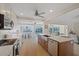 Modern kitchen with white cabinets, stainless appliances, and views of the pool at 5000 Galleon Ct, New Port Richey, FL 34652