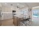 Open kitchen boasts modern cabinetry, stainless appliances, and breakfast bar seating at 5000 Galleon Ct, New Port Richey, FL 34652