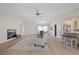 Bright living room featuring neutral decor, fireplace, and open access to the kitchen at 5000 Galleon Ct, New Port Richey, FL 34652