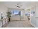 Bright living room with large windows providing views of the canal at 5000 Galleon Ct, New Port Richey, FL 34652