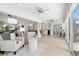 Inviting living room with open floor plan, seamlessly connecting the kitchen and dining areas with waterfront views at 5000 Galleon Ct, New Port Richey, FL 34652