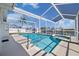 Enjoy a screened pool with a view of the waterfront canal at 5000 Galleon Ct, New Port Richey, FL 34652
