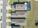 Aerial perspective of homes highlighting roof styles, driveways, and a backyard pool, showcasing property layout at 5388 Fez Ct, Brooksville, FL 34602