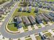 An aerial view shows neighborhood homes with manicured lawns and driveways, offering a glimpse into suburban living at 5388 Fez Ct, Brooksville, FL 34602