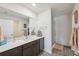 Bathroom with a single sink vanity, a walk-in shower, and neutral decor at 5388 Fez Ct, Brooksville, FL 34602