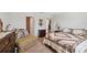 Comfortable bedroom featuring neutral walls, carpeted floors, and a cozy armchair at 5388 Fez Ct, Brooksville, FL 34602