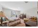 Cozy bedroom with a dresser, comfortable chair, and a window offering natural light at 5388 Fez Ct, Brooksville, FL 34602