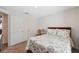 Bedroom with a cozy bed, neutral walls, and a view of the connecting hallway at 5388 Fez Ct, Brooksville, FL 34602