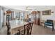 View of formal dining room with wood flooring, large china cabinets, and a grand dining table at 5388 Fez Ct, Brooksville, FL 34602