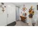 Bright entryway with neutral walls, gray floors and religious decorative items at 5388 Fez Ct, Brooksville, FL 34602