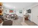 Comfortable living room with a gray leather sofa and modern flooring at 5388 Fez Ct, Brooksville, FL 34602