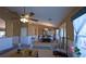 Living room with a ceiling fan, archways, and an adjacent dining area with a chandelier at 5392 Birchwood Rd, Spring Hill, FL 34608