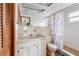 Bathroom with a built-in vanity, and a tiled shower/tub, offering a functional and efficient space at 5441 Alderwood St, Spring Hill, FL 34606