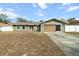 Charming single-story home featuring a well-maintained lawn and a convenient attached garage at 5441 Alderwood St, Spring Hill, FL 34606