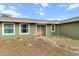 A quaint single-story house featuring large windows that flood the interior with natural light at 5441 Alderwood St, Spring Hill, FL 34606