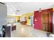 Open-concept living space with eat-in kitchen, colorful walls, and tiled flooring at 5441 Alderwood St, Spring Hill, FL 34606