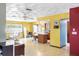Open-concept living space with eat-in kitchen, colorful walls, and tiled flooring at 5441 Alderwood St, Spring Hill, FL 34606