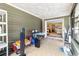 Covered porch with tile flooring, overhead lighting, and views to the interior at 5441 Alderwood St, Spring Hill, FL 34606
