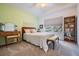 Cozy bedroom featuring warm colors, natural light, and comfortable carpeting at 6329 Cardinal Crest Dr, New Port Richey, FL 34655