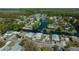 Aerial view of a home on a canal with nearby boat docks and a peaceful community at 6448 W Richard Dr, Weeki Wachee, FL 34607