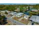 Aerial shot of house on water, with shed, palm trees, and well-kept landscaping at 6448 W Richard Dr, Weeki Wachee, FL 34607