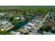 Aerial view of community, waterfront access, mature trees and tranquil neighborhood at 6448 W Richard Dr, Weeki Wachee, FL 34607