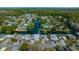 Aerial view of the waterfront community featuring direct canal access, mature trees and charming single Gathering homes at 6448 W Richard Dr, Weeki Wachee, FL 34607