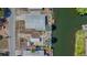 Aerial view of the home showcasing its roof, waterfront access and dock at 6448 W Richard Dr, Weeki Wachee, FL 34607