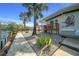 A waterfront property with a wooden deck, landscaped yard, and easy access to water activities and serene views at 6448 W Richard Dr, Weeki Wachee, FL 34607