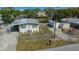 Exterior view of the house featuring driveway and additional parking at 6448 W Richard Dr, Weeki Wachee, FL 34607