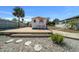 Exterior view of a home with a patio, landscaping, and a palm tree at 6448 W Richard Dr, Weeki Wachee, FL 34607