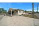 Exterior view of the home with a covered carport and well-maintained surroundings at 6448 W Richard Dr, Weeki Wachee, FL 34607