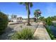 Charming property with a well-kept yard featuring stone accents, waterfront access, and lush landscaping at 6448 W Richard Dr, Weeki Wachee, FL 34607