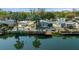 Charming single Gathering canal-front home with boat dock, tropical landscaping, and tranquil water views at 6448 W Richard Dr, Weeki Wachee, FL 34607