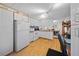Bright kitchen with white appliances and cabinetry, with adjacent office space at 6448 W Richard Dr, Weeki Wachee, FL 34607