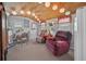 Cozy living room with unique bamboo ceiling, comfortable seating, and natural light at 6448 W Richard Dr, Weeki Wachee, FL 34607