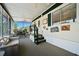 Screened porch area with nautical decor, dining table, and comfortable lounge seating at 6448 W Richard Dr, Weeki Wachee, FL 34607