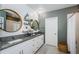 Modern bathroom featuring double vanity, granite countertops, and a shower with a white subway tile at 6482 Beverly Hills Dr, Zephyrhills, FL 33541