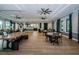 Spacious clubhouse featuring modern decor, wood floors, and seating areas, perfect for community gatherings and socializing at 6482 Beverly Hills Dr, Zephyrhills, FL 33541
