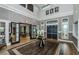 Bright lobby with high ceiling, hardwood floors, and comfortable seating at 6482 Beverly Hills Dr, Zephyrhills, FL 33541