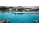 Large community pool with an inviting lounge area, perfect for residents to relax and enjoy the outdoors at 6482 Beverly Hills Dr, Zephyrhills, FL 33541