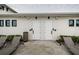 Conveniently located poolside restrooms with modern fixtures, landscaping and lounge chairs at 6482 Beverly Hills Dr, Zephyrhills, FL 33541