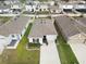 Aerial view of a well-maintained home with a long driveway and green lawn at 6644 Longboat Dr, Brooksville, FL 34604