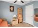 Bright bedroom with wood-look floors, a ceiling fan, and comfortable daybed at 6644 Longboat Dr, Brooksville, FL 34604