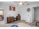 Comfortable bedroom featuring wood-look floors, ceiling fan and en suite bathroom at 6644 Longboat Dr, Brooksville, FL 34604