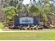Stone entrance sign to the Seagate community surrounded by lush landscaping at 6644 Longboat Dr, Brooksville, FL 34604