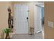 Inviting entryway featuring a white front door, decorative accents, and neutral-toned walls at 6644 Longboat Dr, Brooksville, FL 34604